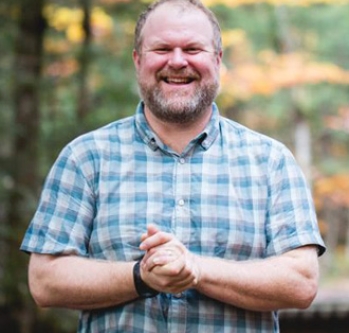 Man with blonde hair, smiling