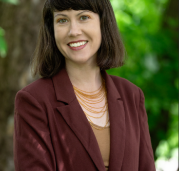 Woman with brown hair, smiling 