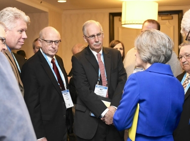 Bill Peterson (center) surrounded by Iowa county officials, listens to Sen. Joni Ernst (R-Iowa) during the 2019 NACo Legislative Conference. Photo by Lana Farfan  