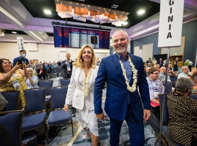 Gore and wife Elizabeth walk to the stage after he was elected NACo 2nd VP in 2022. Photo by Denny Henry