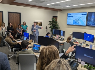 Members and partners of NACo's Familiar Faces Initiative Leadership Network observe the OC Be Well dispatch center in action in Orange County, Calif.