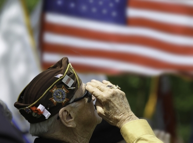 Veteran saluting flag