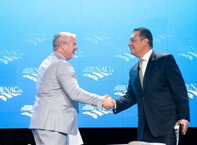 NACo President James Gore (left), a Sonoma County, Calif. supervisor, greets Sen. Alex Padilla (D-Calif.) March 4 at the NACo Legislative Conference General Session at the Washington Hilton. Photo by Denny Henry