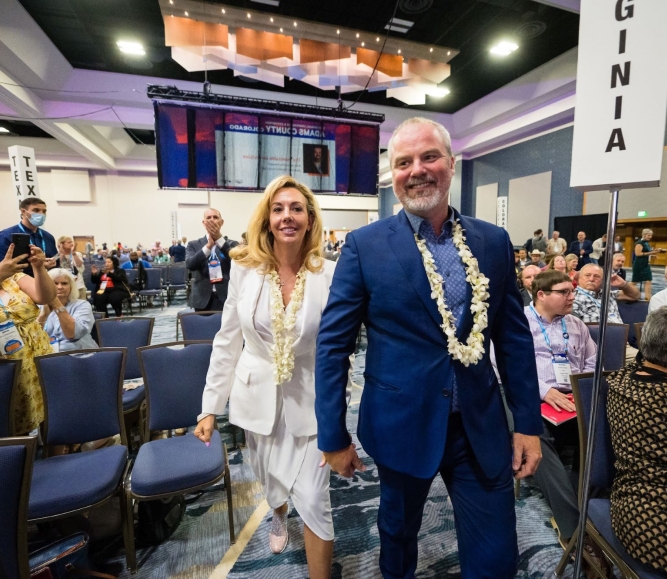 Gore and wife Elizabeth walk to the stage after he was elected NACo 2nd VP in 2022. Photo by Denny Henry