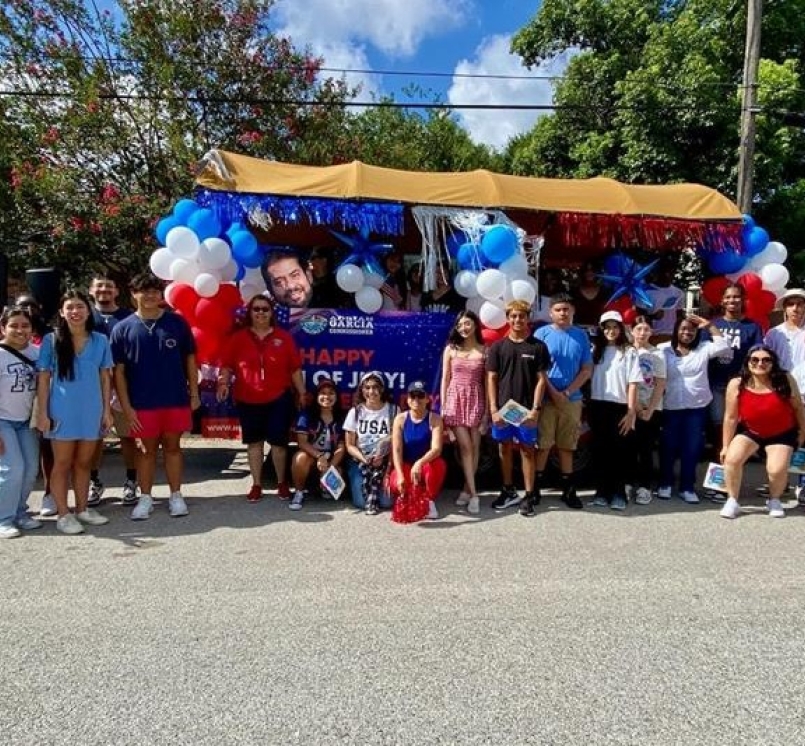 Student2Government Leadership Academy students pose in front of a Fourth of July float they made.