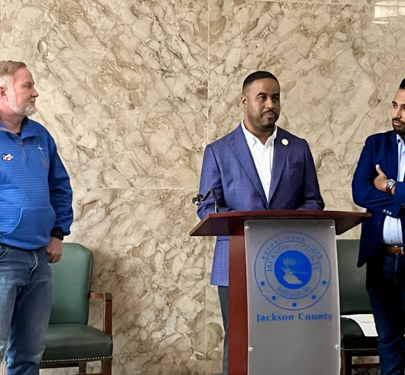 DaRon McGee speaks at a press conference flanked by Jackson County legislator colleagues Sean Smith (left) and Manuel Abarca.