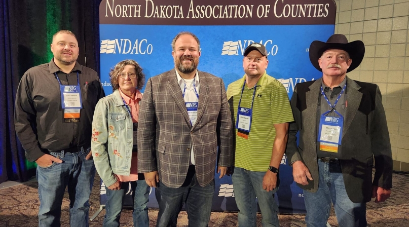 North Dakota Association of Counties (NDACo) President Jayme Tenneson (center), with colleagues on the association’s Board of Directors (l-r): Nick Moser, third vice president (Cavalier County), Trudy Ruland, first vice president (Mountrail County), Tenneson, Chad Kaiser, second vice president (Stutsman county) and Steve Lee, past president (McLean County). Photo courtesy of NDACo