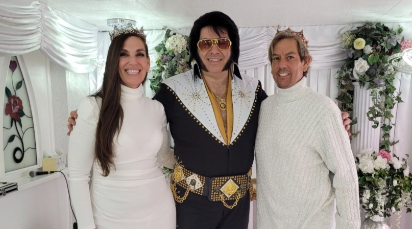 Diana and Charles Printzen pose with an Elvis Presley impersonator after getting married at the Little White Wedding Chapel in Clark County, Nev.