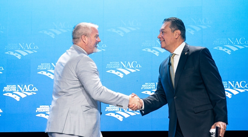 NACo President James Gore (left), a Sonoma County, Calif. supervisor, greets Sen. Alex Padilla (D-Calif.) March 4 at the NACo Legislative Conference General Session at the Washington Hilton. Photo by Denny Henry