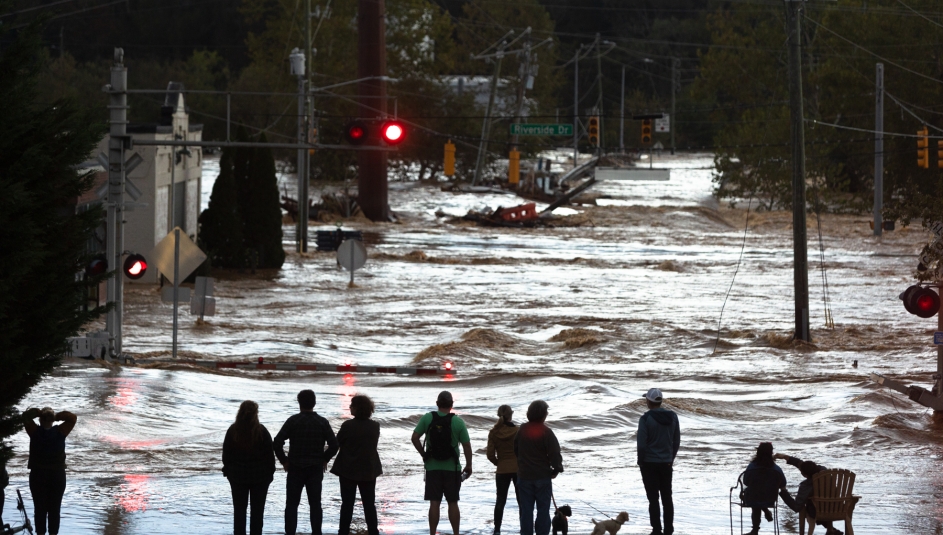 Flood waters rise Sept. 27 from the French Broad River in the River Arts District in Asheville in Buncombe County, N.C. after Tropical Storm Helene pounded the area with rain. Photo by Colby Rabon / Carolina Public Press