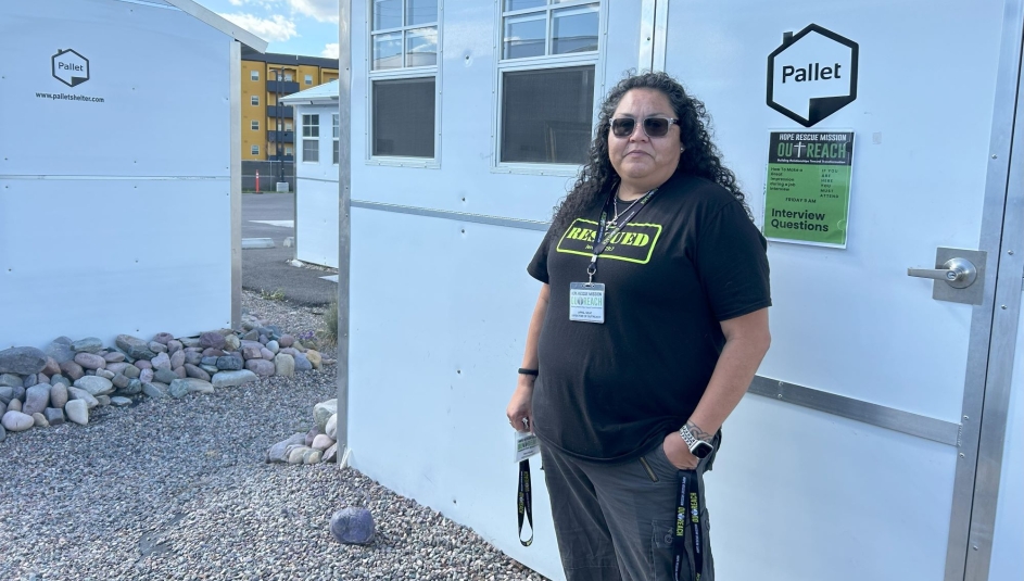 April Seat, director of Outreach for Hope Rescue Mission, shows off a pallet shelter in the Missoula County TSOS. Photo by Charlie Ban