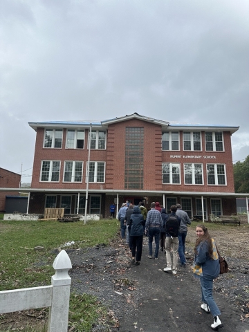 BRECC Coalition members touring the Rupert Elementary School to affordable housing project.